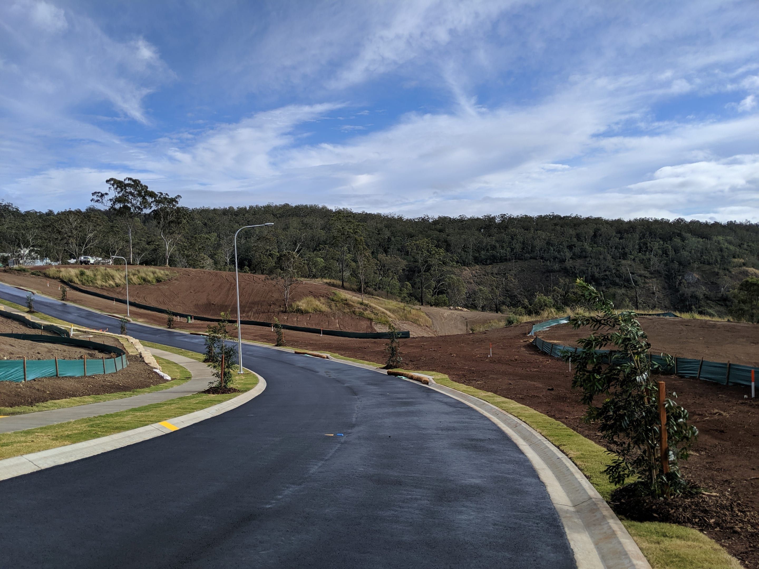 New sealed subdivision street with kerbs, footpath and street lights